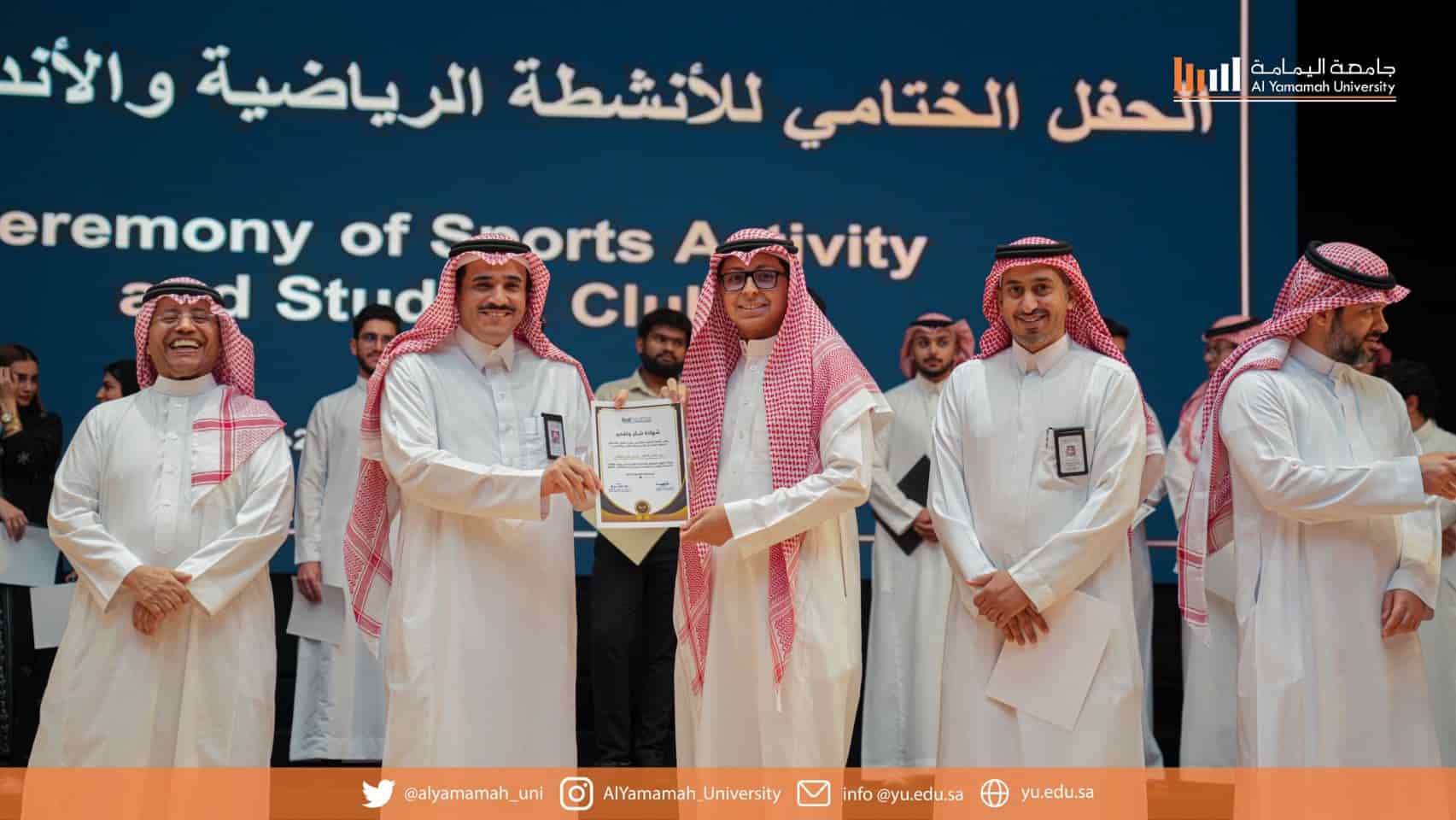 Yazeed Al-Khalaf (club lead) receiving the award on behalf of the club